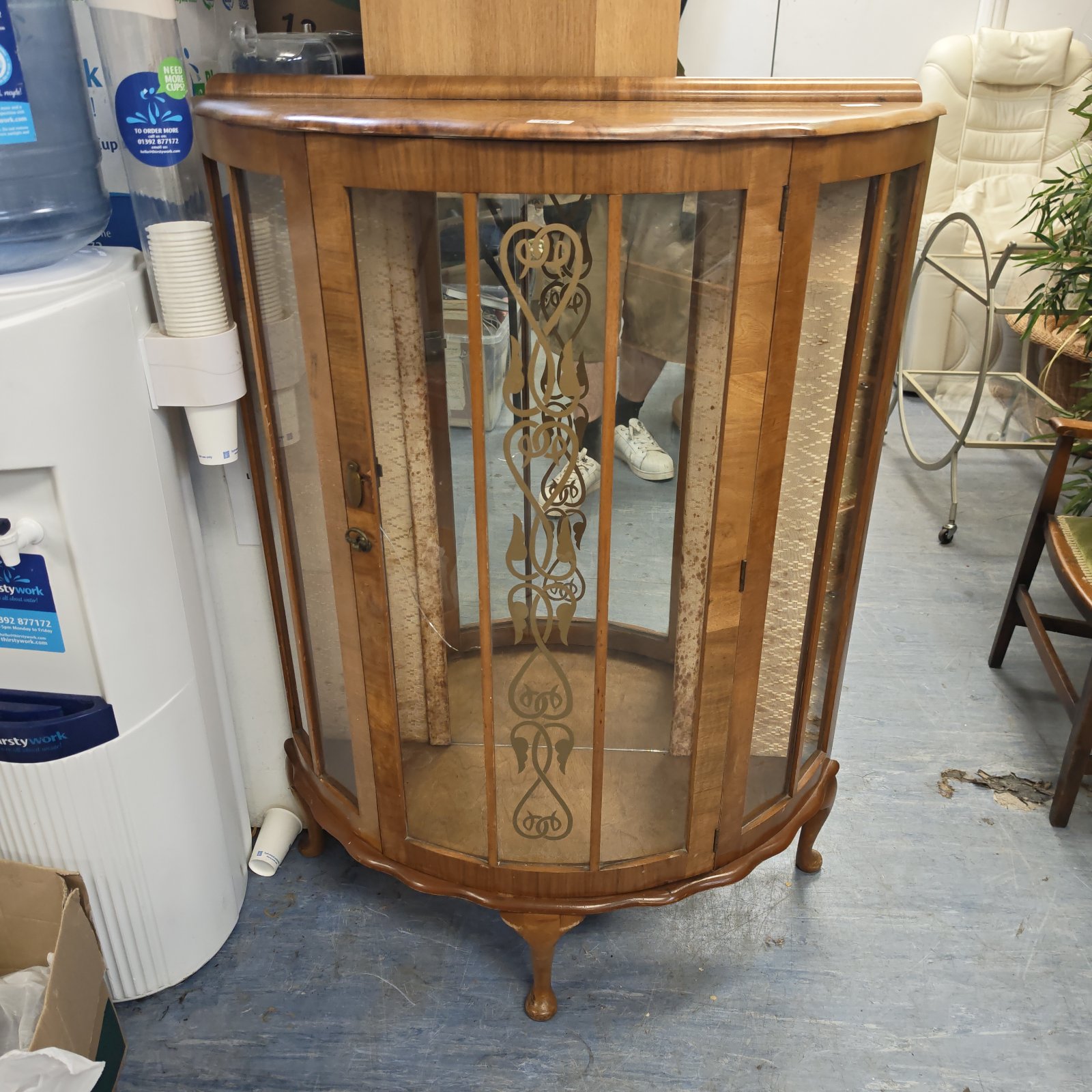 Vintage 1950s walnut china display cabinet with curved glass.