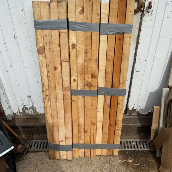 Stack of 2x4 lumber bundles for construction projects.