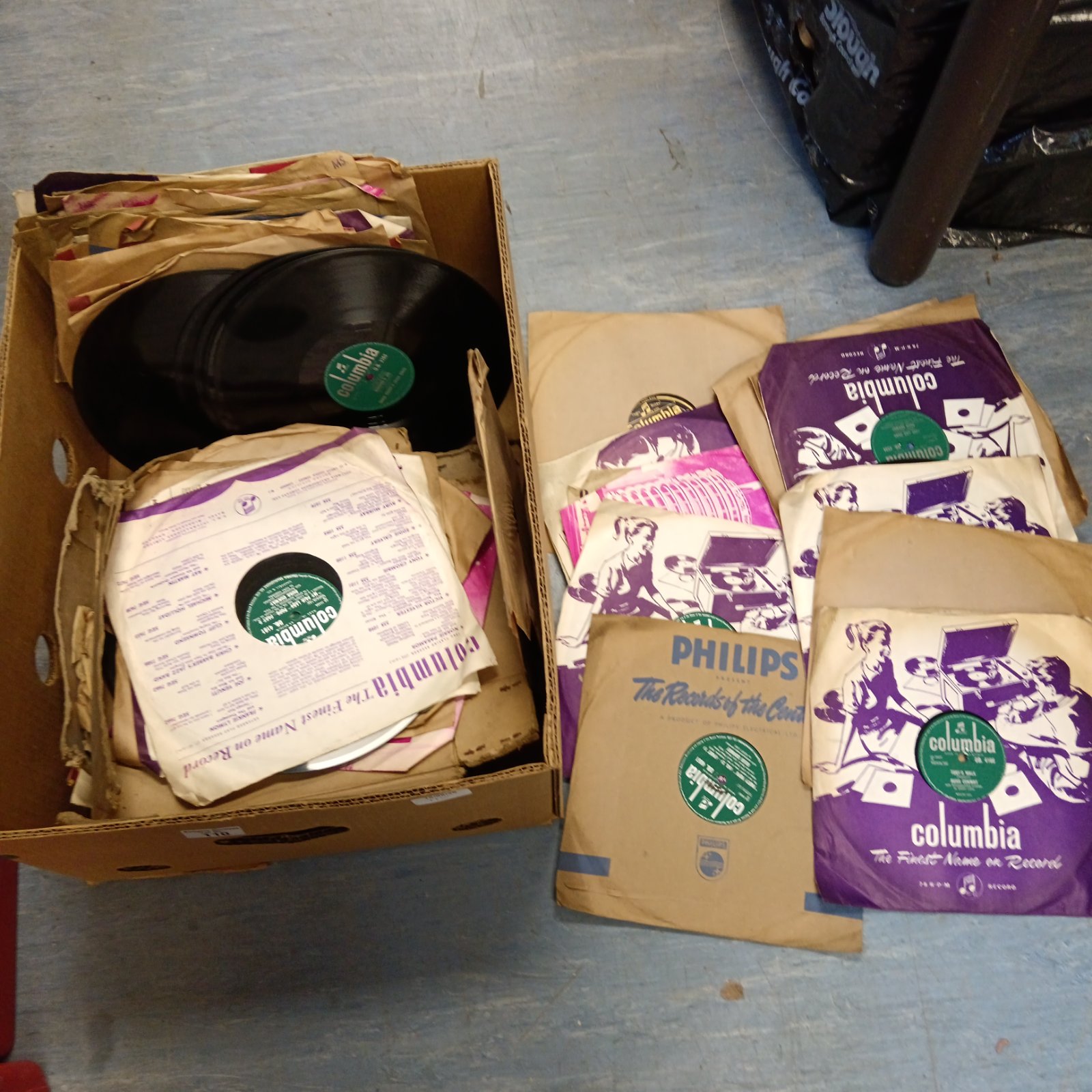 Large box of vintage 78 records and gramophone record sleeves.