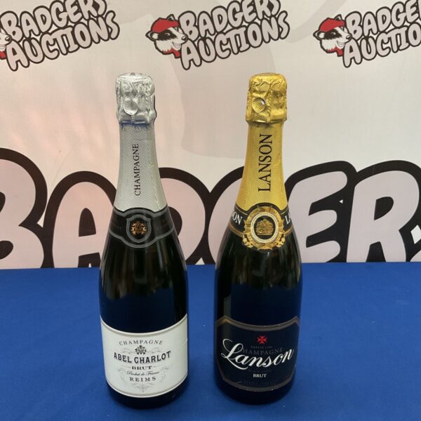 Sealed bottles of Abel Charlot and Lanson Brut Champagne.