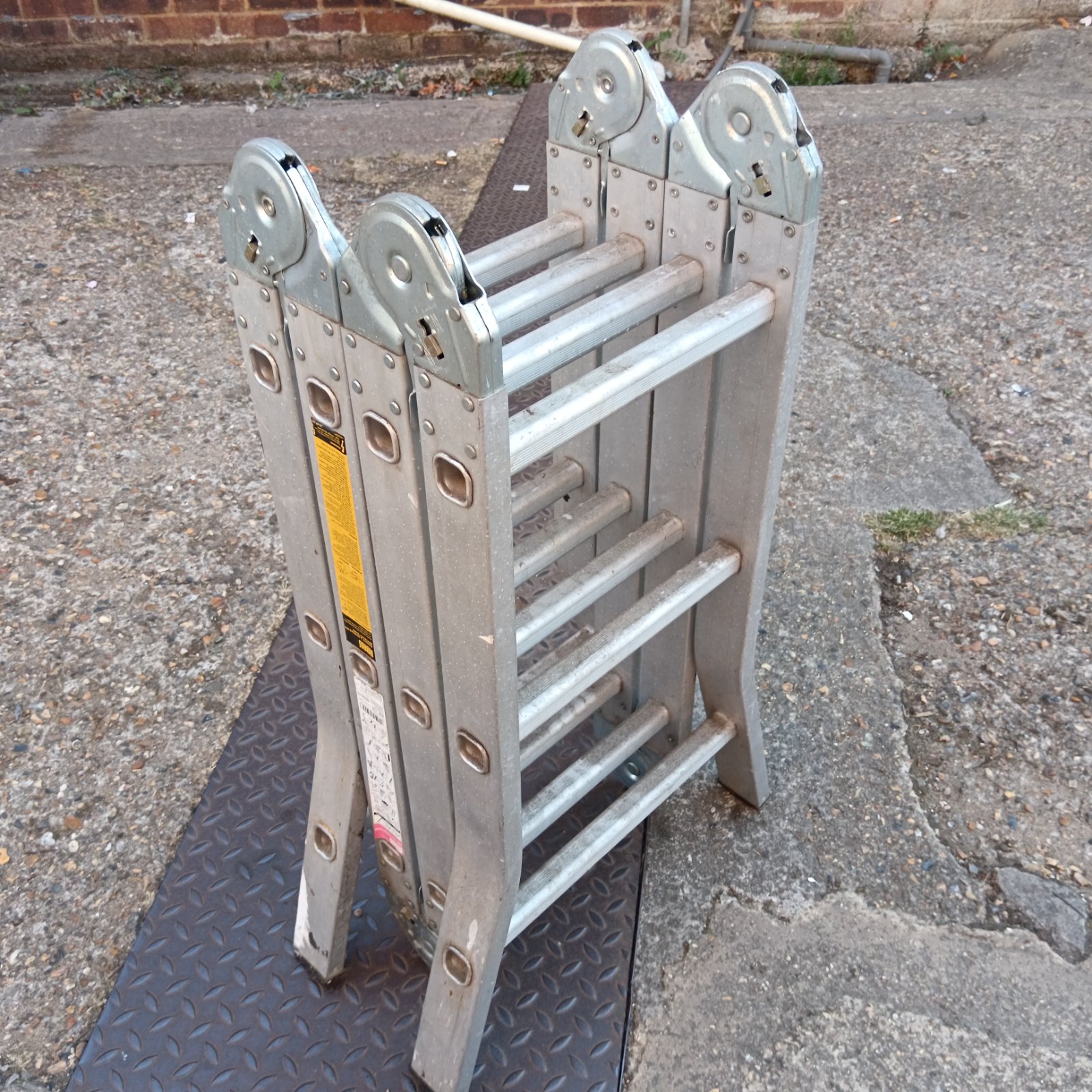 Used Abru folding aluminium ladder for home and garden use.