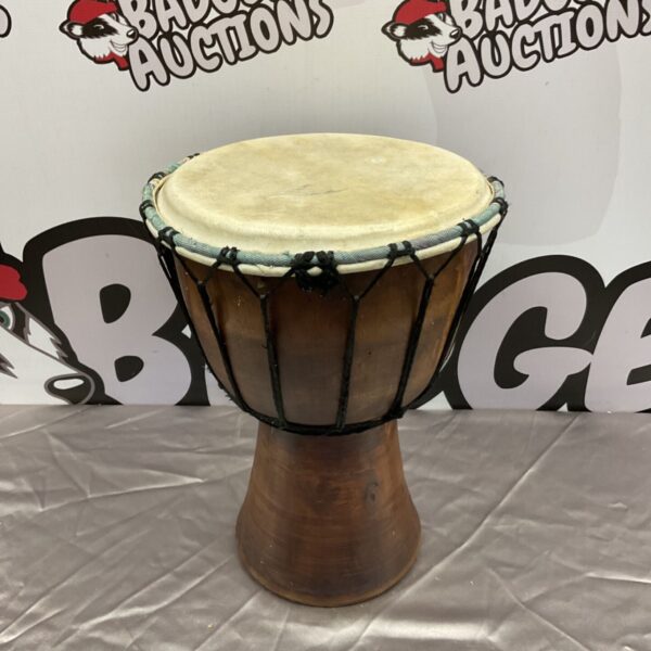 Hand-turned African bongo drum with a dark wood body.
