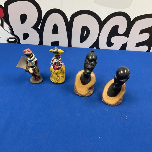 Group of four antique African carved wooden figurines.