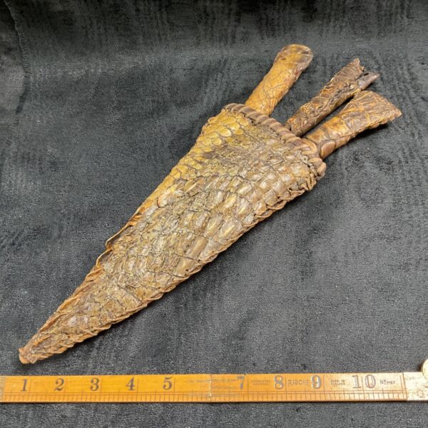 Set of three African knives with crocodile skin handles.