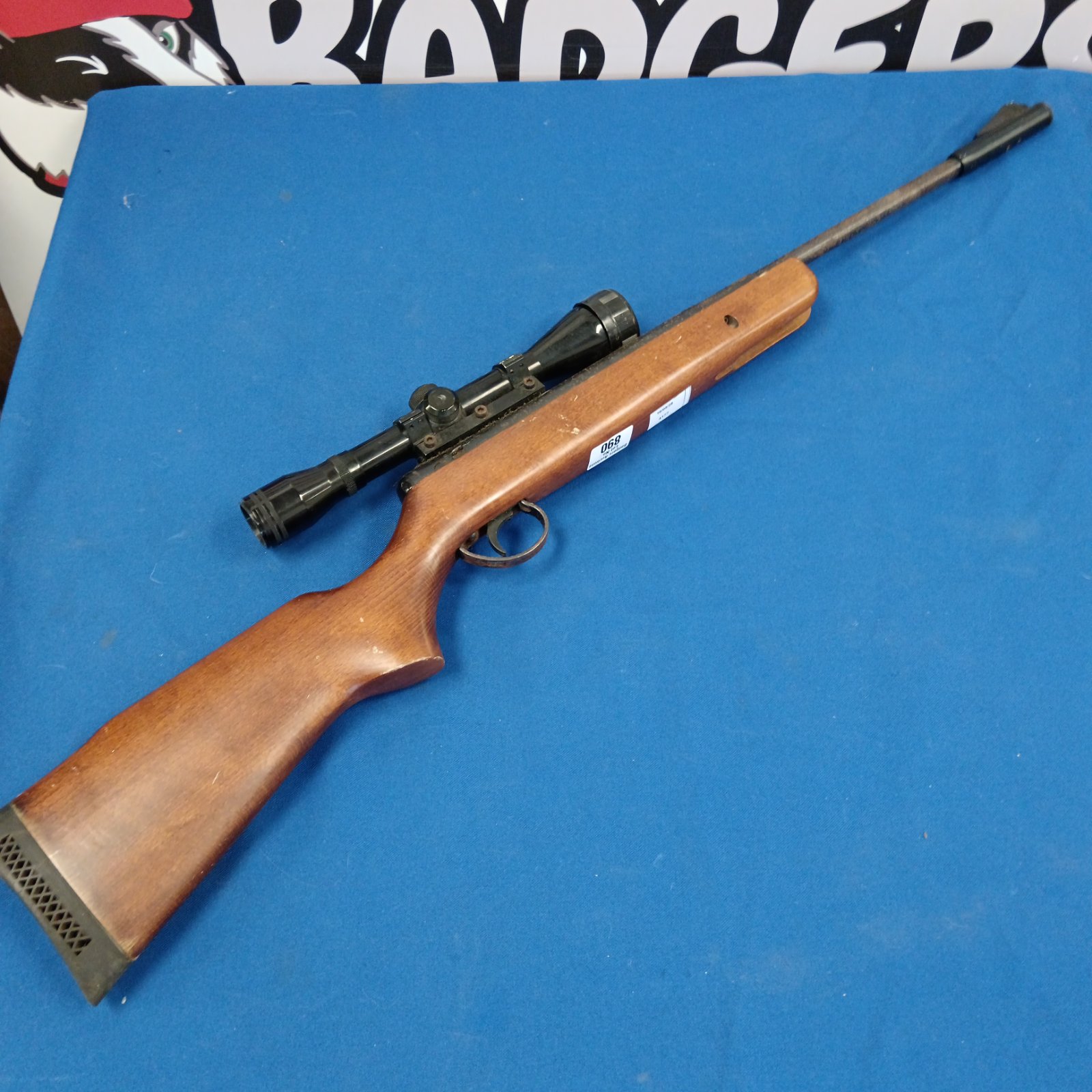 Break barrel air rifle with scope for target practice.