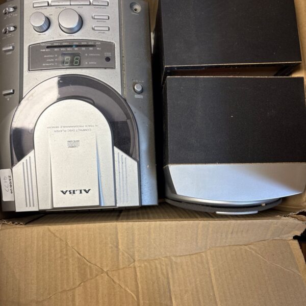Vintage Alba compact disc player with speakers, side view.