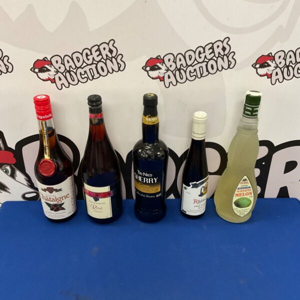 Vintage alcohol lot including Sherry and Melon Schnapps bottles.