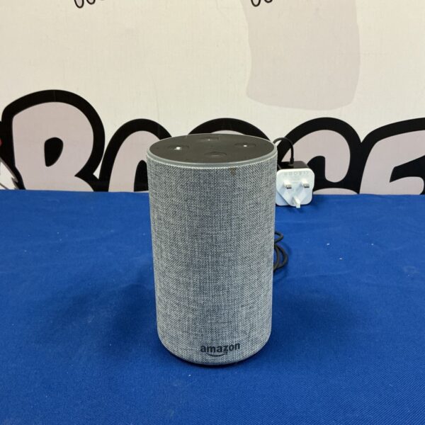 Grey Amazon Alexa smart speaker on a dark surface.
