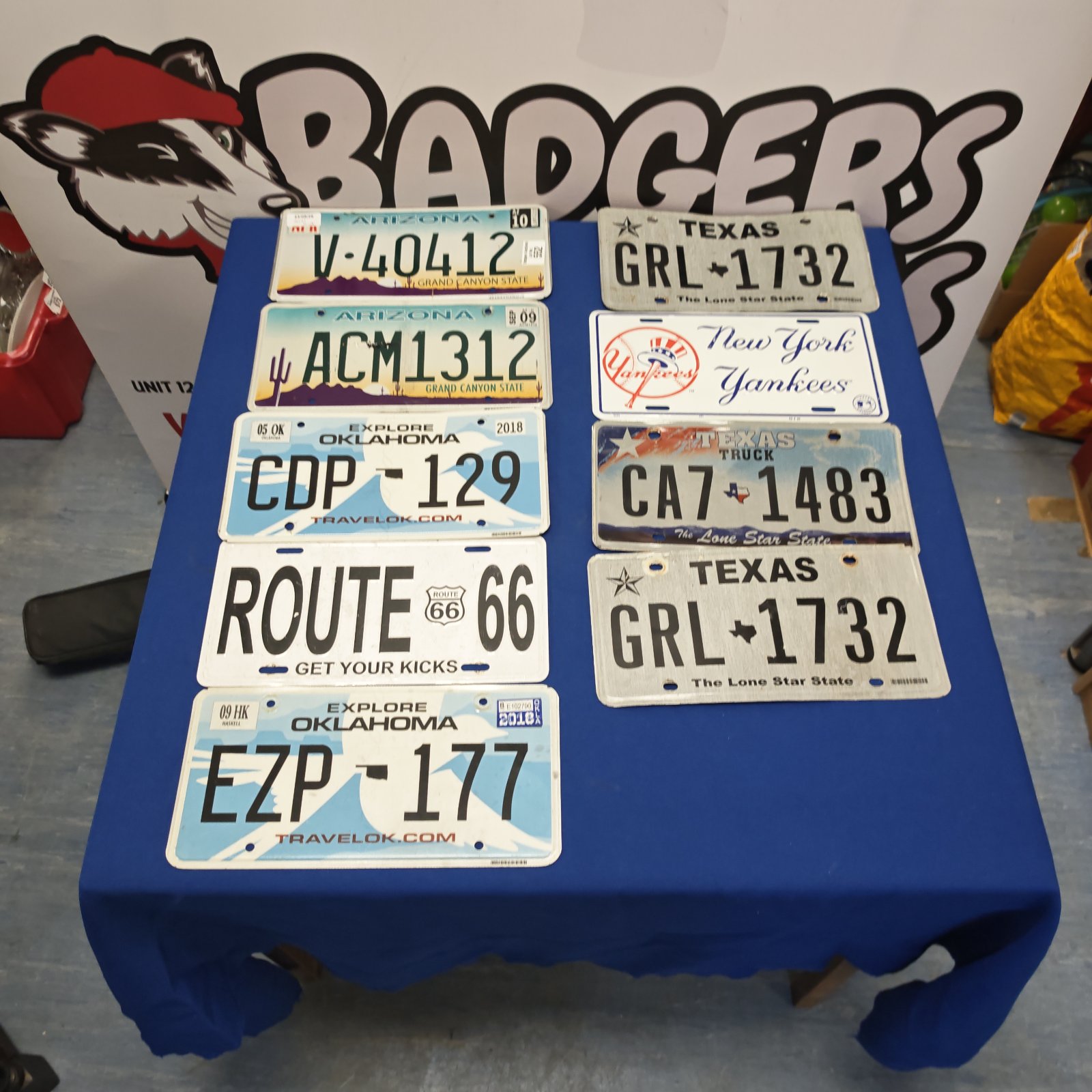 Vintage American license plates from Arizona, Texas, and Oklahoma.