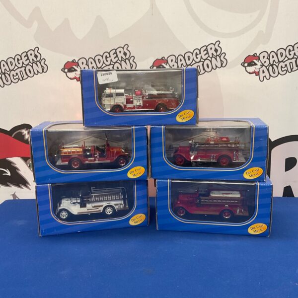 Red American Mint diecast fire truck model for collectors.