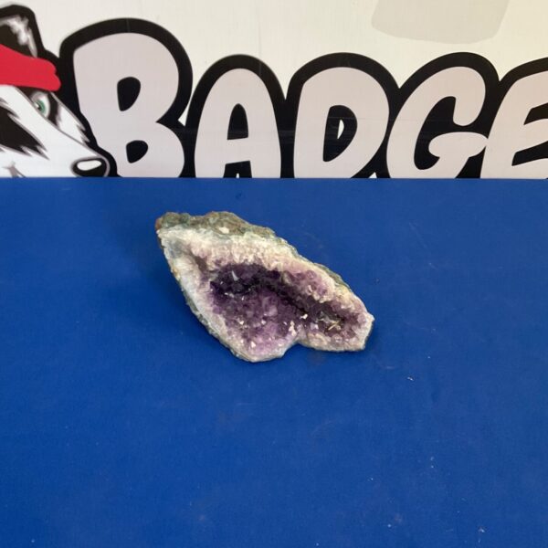 Natural amethyst geode with purple quartz crystals inside.