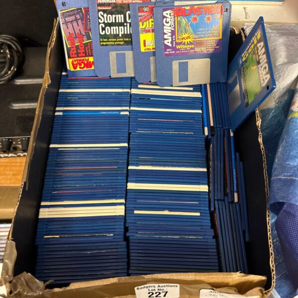 Large collection of vintage Commodore Amiga 5.25" discs for retro gaming.
