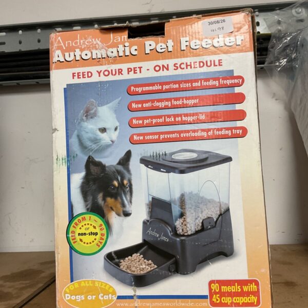 Vintage Andrew Jan automatic pet feeder in original packaging.