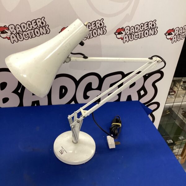 White anglepoise lamp with adjustable arm for desk or task lighting.