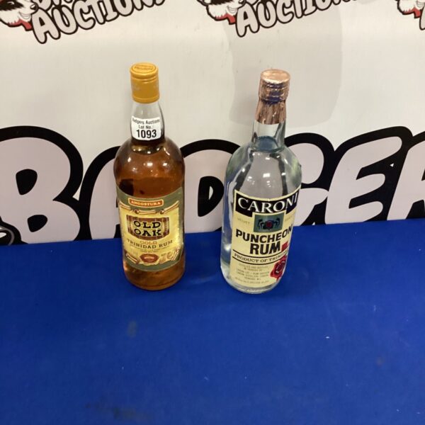 Two bottles of rum, including Angostura Old Oak, for collectors.