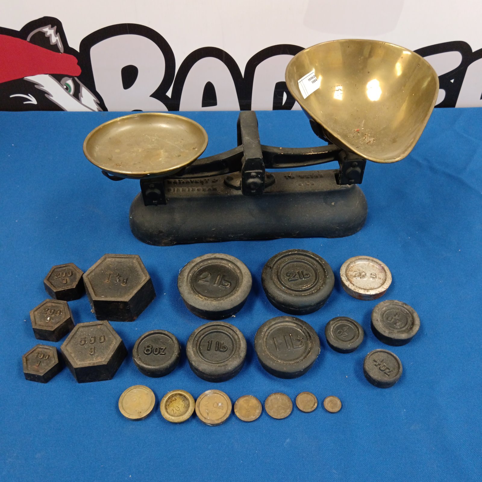 Antique Avery scales with weights, a vintage cast iron and brass weighing device.