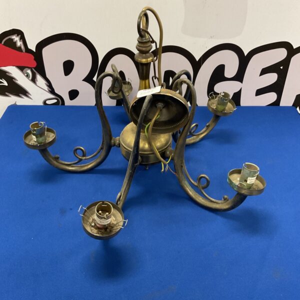 Ornate antique brass chandelier with five arms.