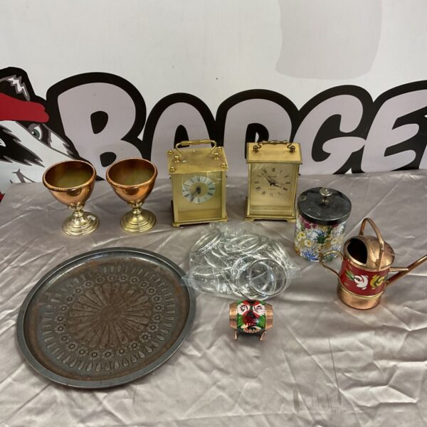 Antique lot featuring carriage clocks, copper goblets, and a Grimwades honey pot.