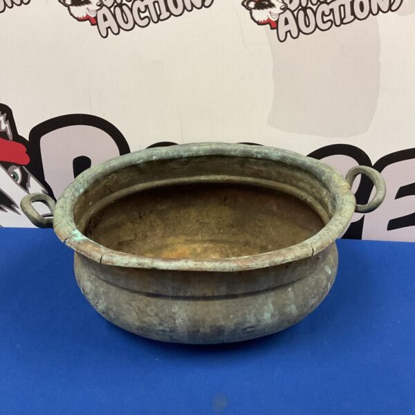 Antique copper urli, a traditional South Indian cauldron with patina.