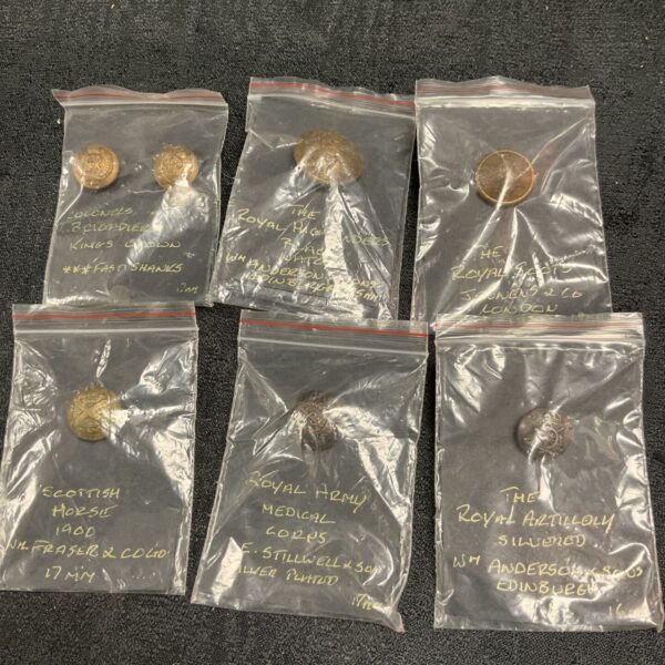 Antique military brass buttons collection, Victorian era military uniform details.