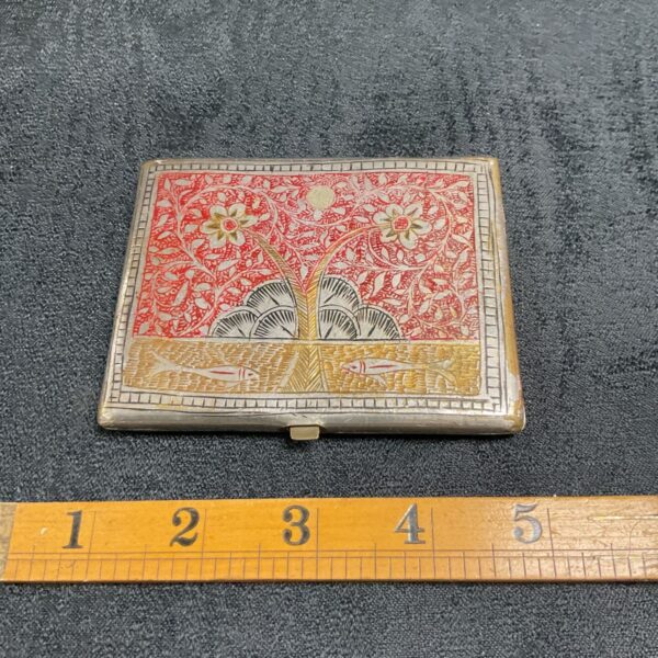 Antique Persian cigarette case with floral and fish enamel design.