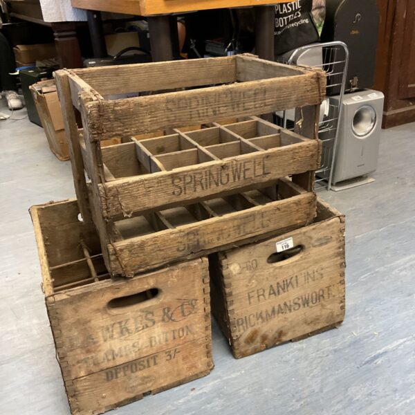 Antique wooden bottle crates including Springwell, Hawkes & Co, and Franklin’s Rickmansworth.