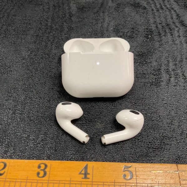 Apple AirPods with open charging case and two earbuds visible.