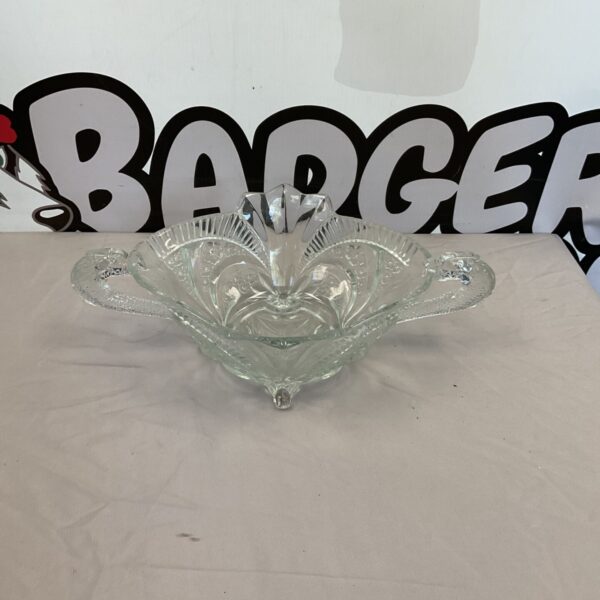 Vintage Art Deco pressed glass bowl with geometric design.