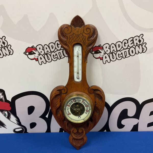 Antique Art Nouveau barometer with detailed hand carving and mercury thermometer.