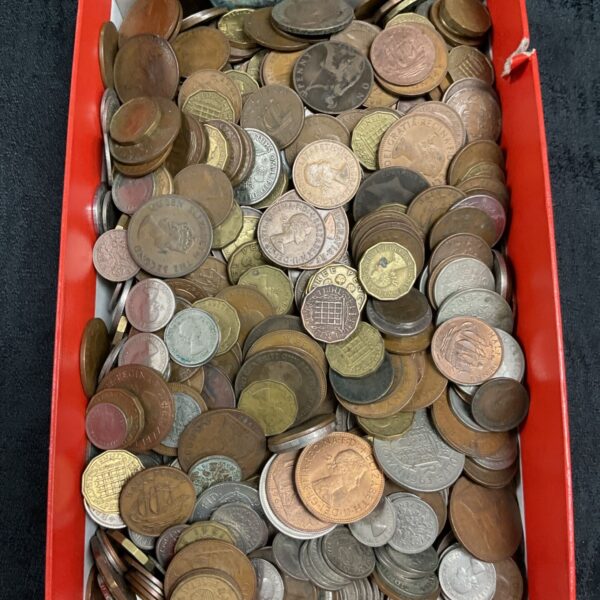 Tray of assorted British coins, including vintage pennies and mixed denominations.