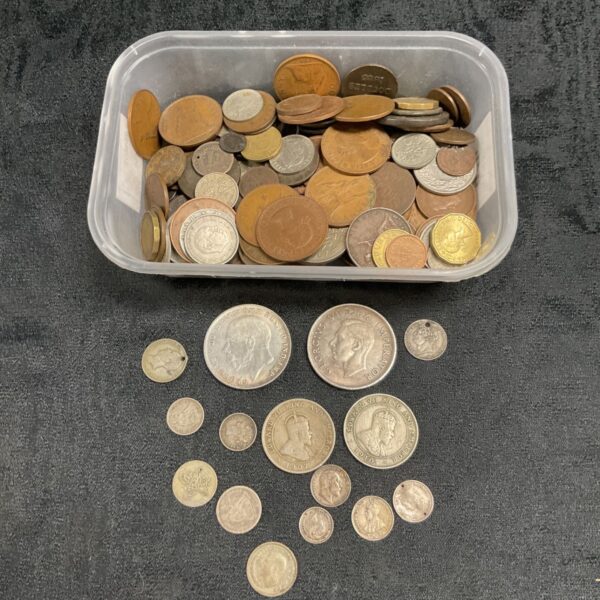Assorted silver and vintage coins in a plastic tub.