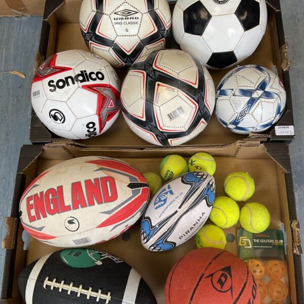 Assorted sports balls lot including footballs, rugby and tennis balls.