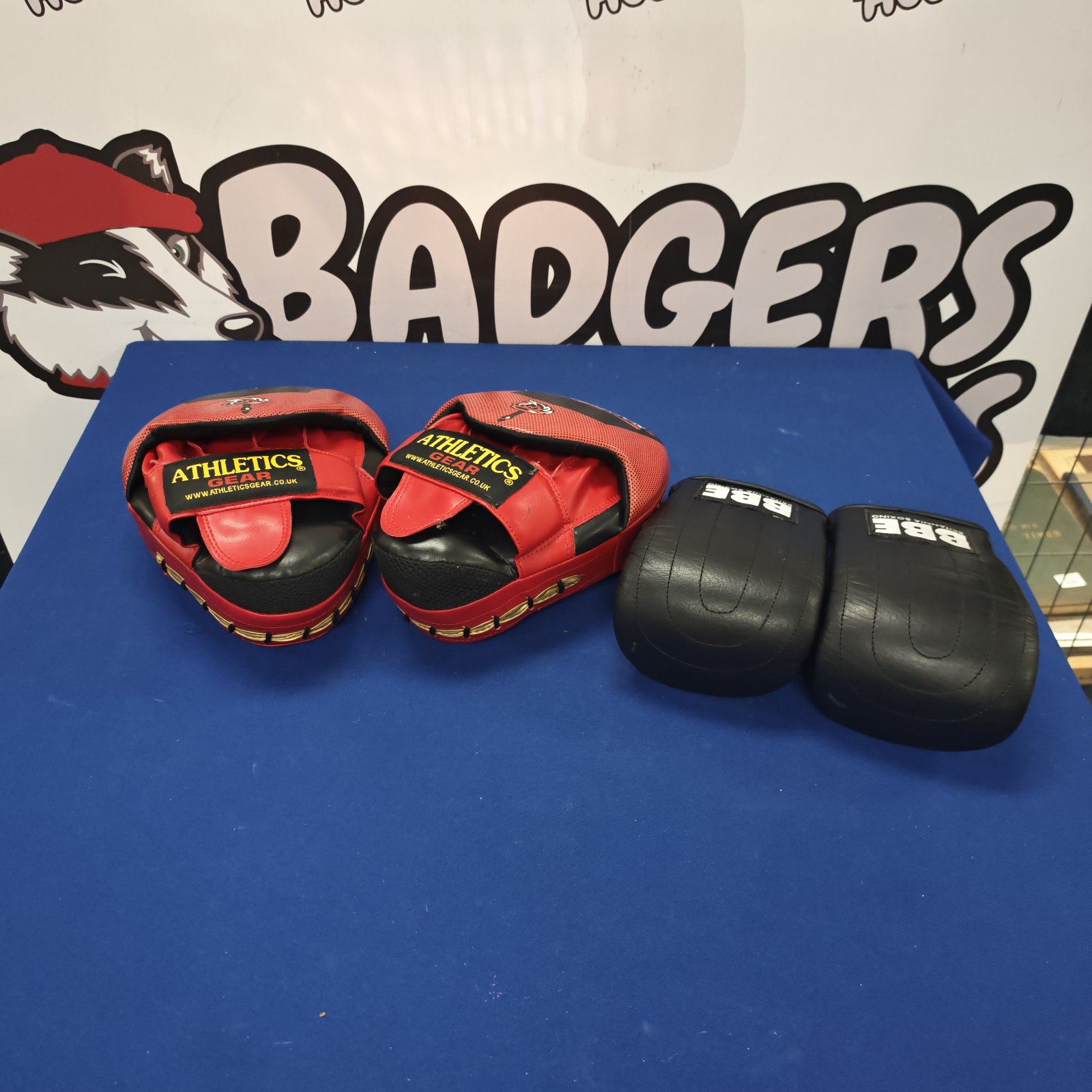 Athletics Gear BBE boxing gloves and sparring pads for training.