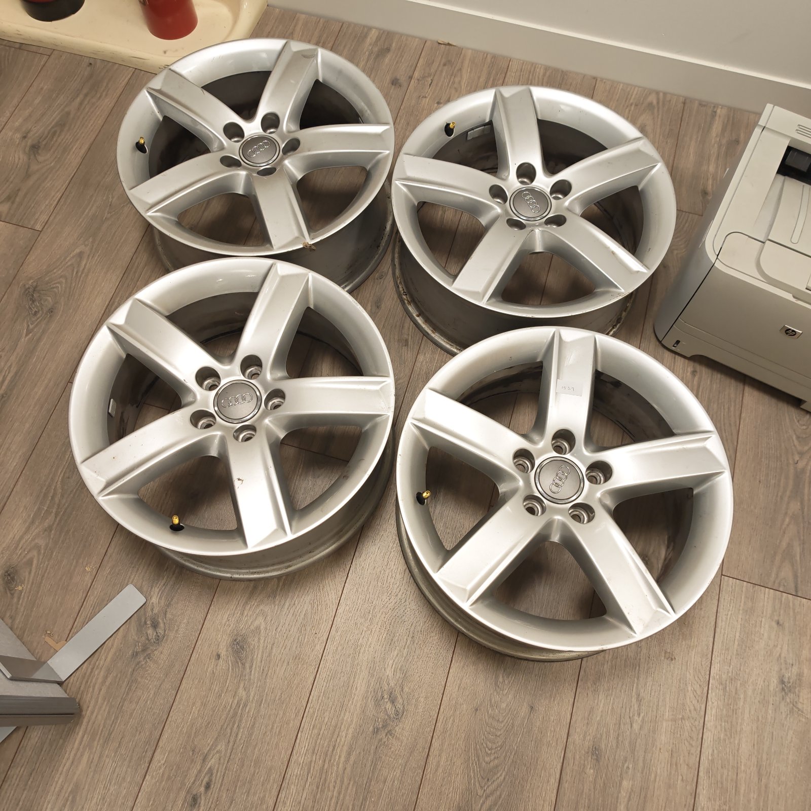 Set of four Audi alloy wheels in good condition, ideal for car enthusiasts.