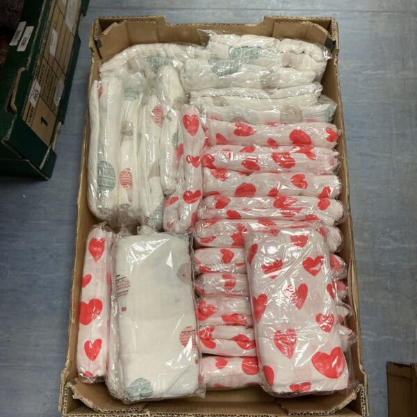 Quantity of white baby muslins with a red pattern, ideal for baby care.