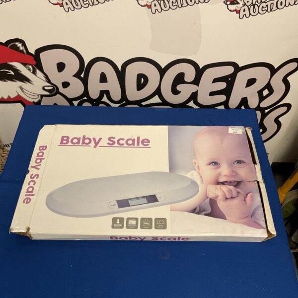 Digital baby scale with display for infant weighing.