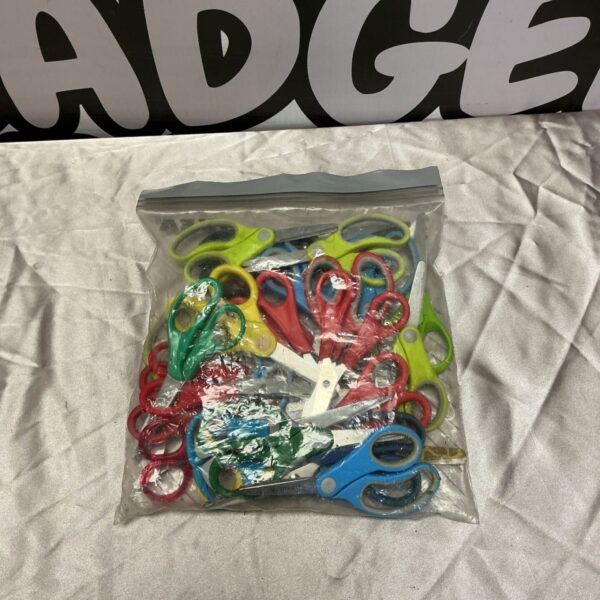 A colourful bag of assorted scissors for crafts and school.
