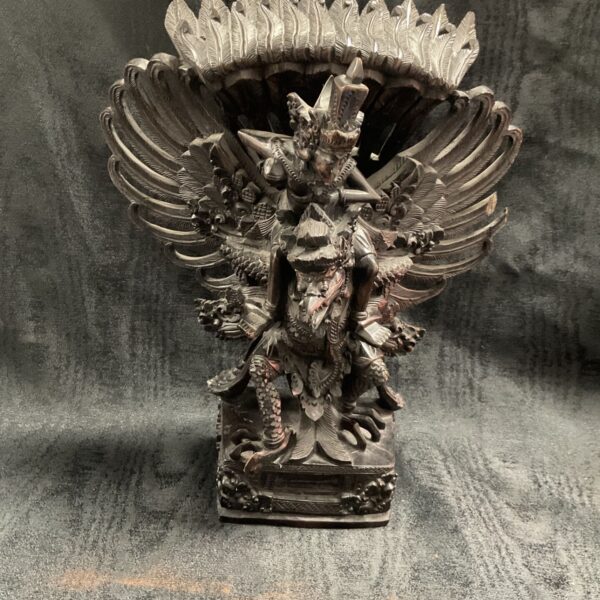 Detailed Balinese Garuda Vishnu sculpture in dark hardwood.