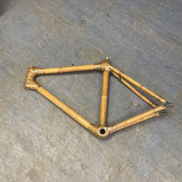Vintage bamboo bicycle frame with unique construction.