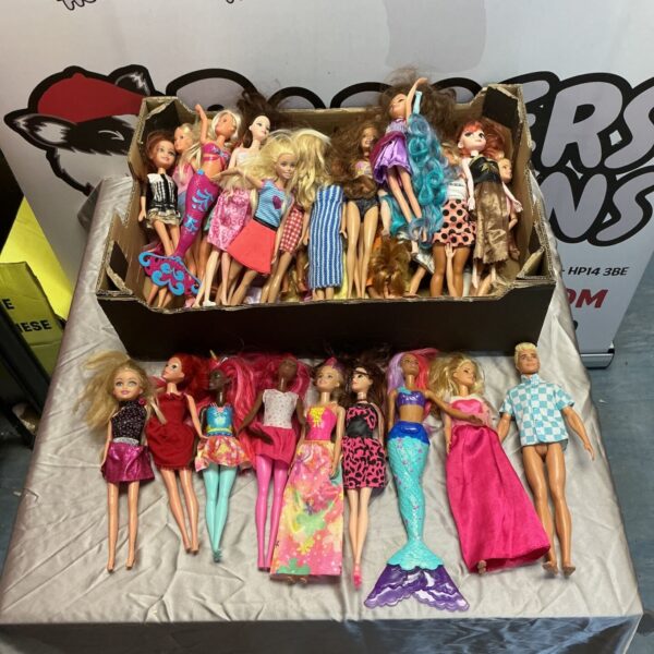 Assorted Barbie dolls in a box, vintage fashion doll collection.