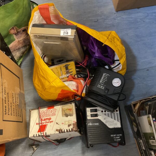 Lot of battery chargers and tools including a tyre inflator.