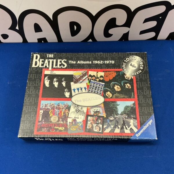 Ravensburger Beatles jigsaw puzzle featuring album covers.