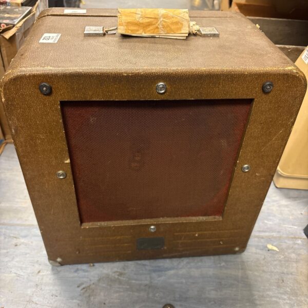 Vintage Bell and Howell speaker box with brown finish.