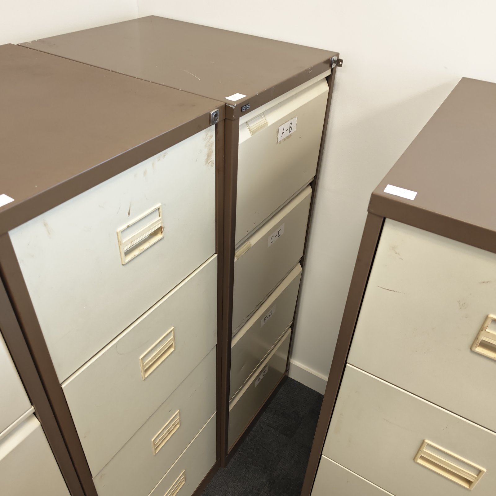Grey Bisley filing cabinet with four drawers, vintage office storage.