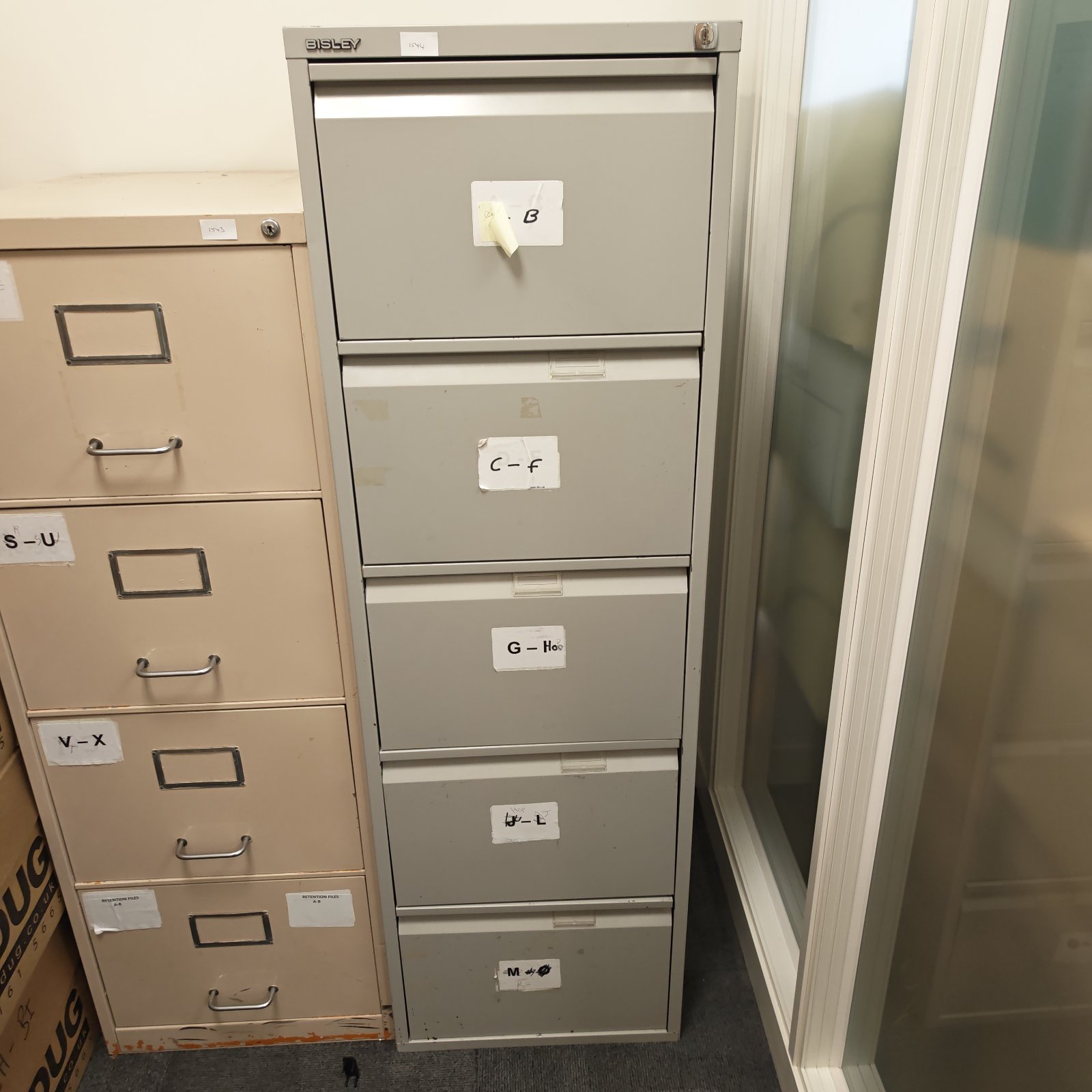 Grey Bisley filing cabinet with five drawers, vintage office storage.