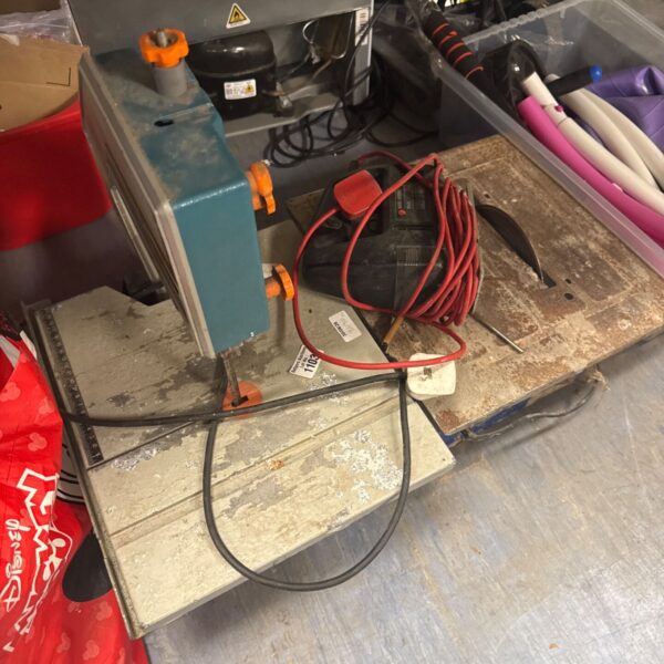 Used Black & Decker tabletop band saw with jigsaw and tile cutter.