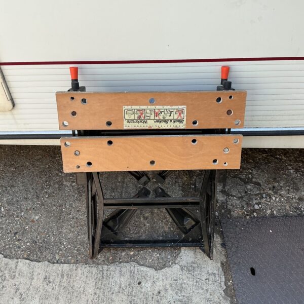 Vintage Black and Decker Workmate workbench in used condition.