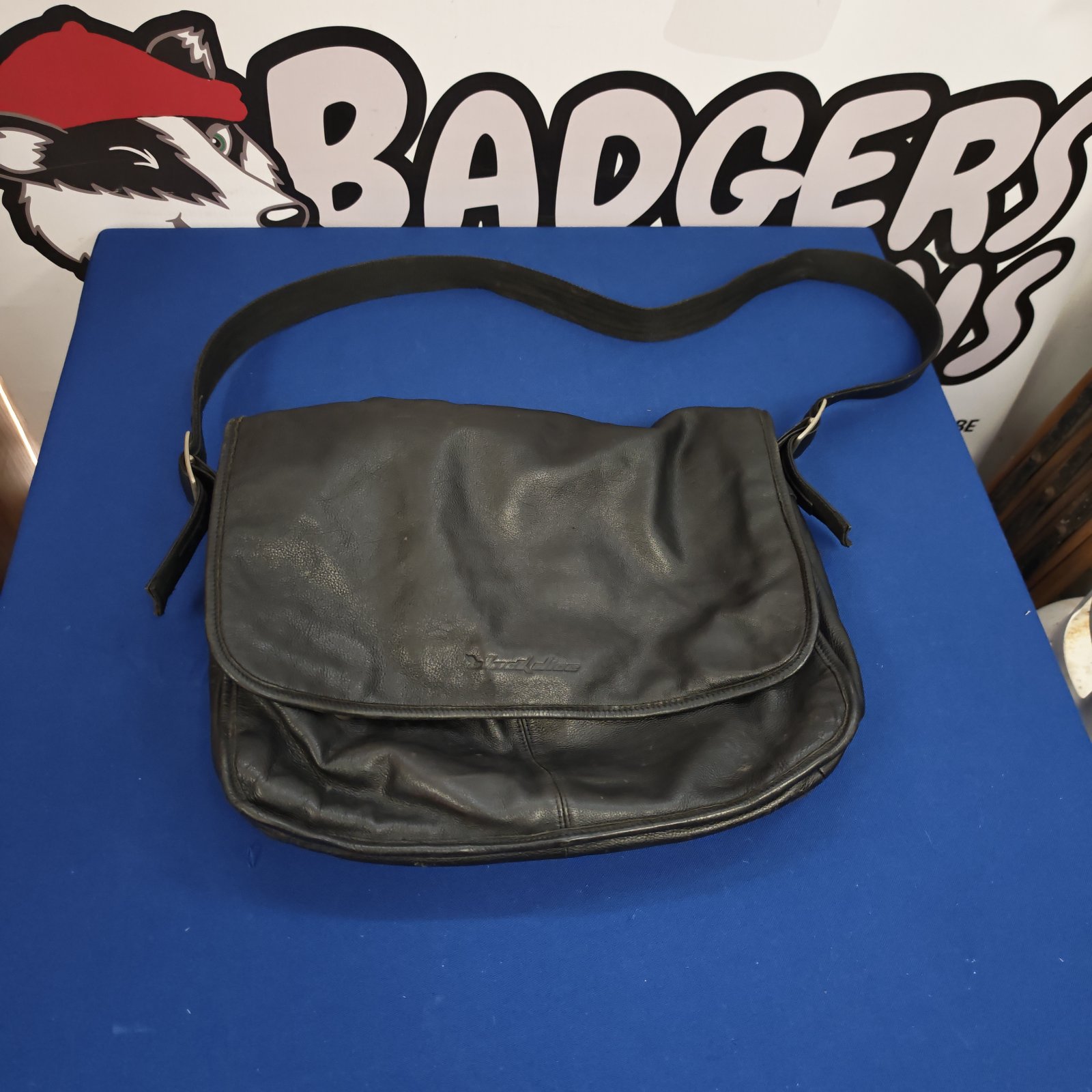 Vintage black leather handbag with a unique dice design detail.