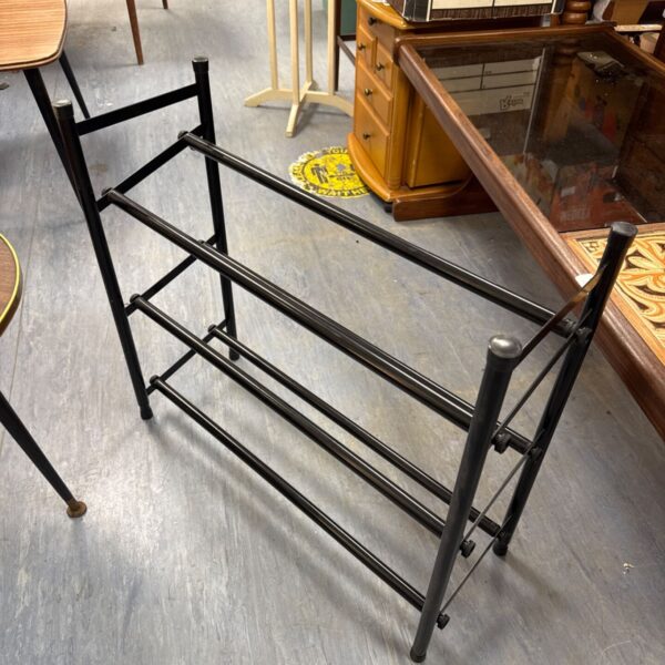 Vintage black metal shoe rack, approximately 2ft long, for hallway storage.