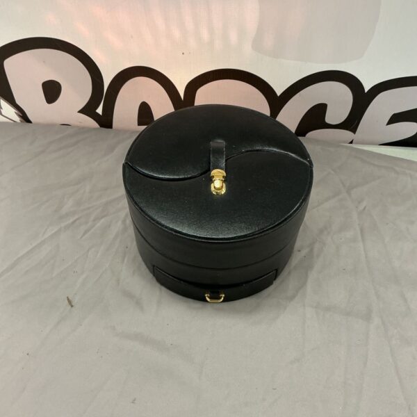 Black Ying Yang jewellery box with gold clasp.